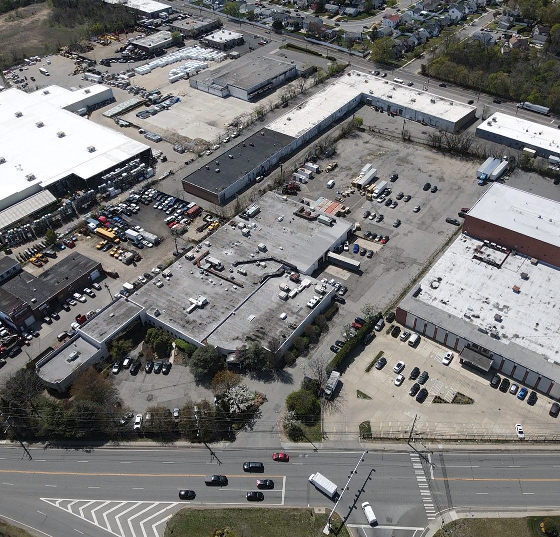 Fenced industrial outdoor storage yard, aerial view