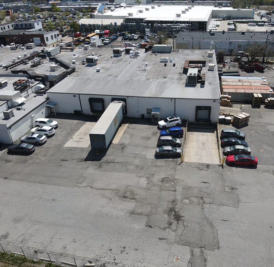 Stabilized outdoor storage lot with trailers and trucks